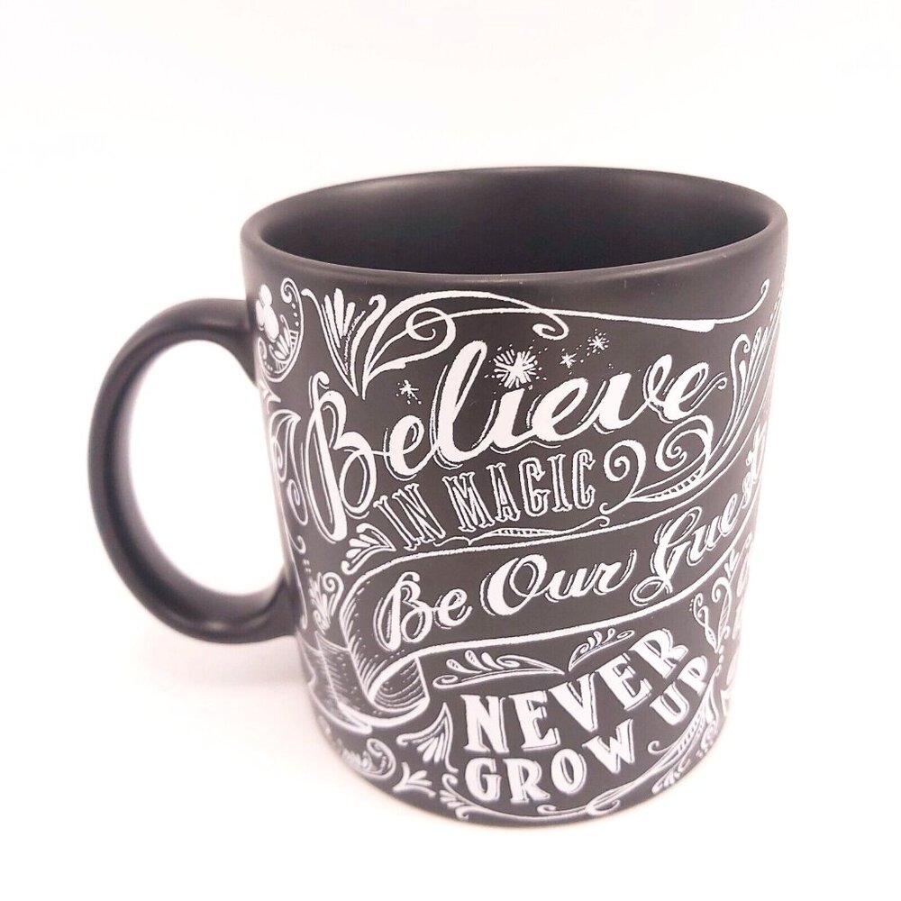 Disney Parks Black Chalkboard Mug Believe in Magic Be Our Guest Never Grow Up